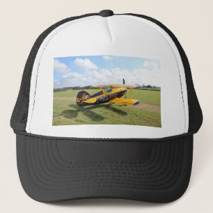 Aerobatic Bi-Plane On The Field Trucker Hat