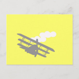 Aeroplane on plain yellow background. postcard