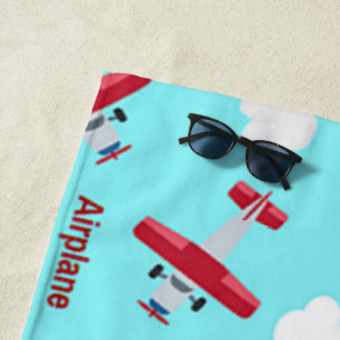 Aeroplane pattern on blue beach towel