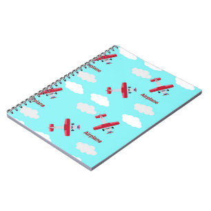 Aeroplane pattern on blue notebook
