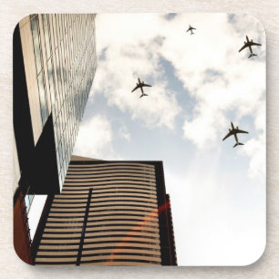 Aeroplanes flying over buildings coaster