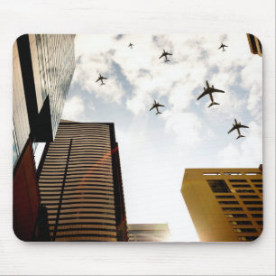 Aeroplanes flying over buildings mouse pad