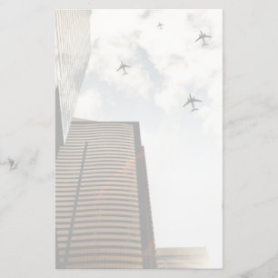 Aeroplanes flying over buildings stationery