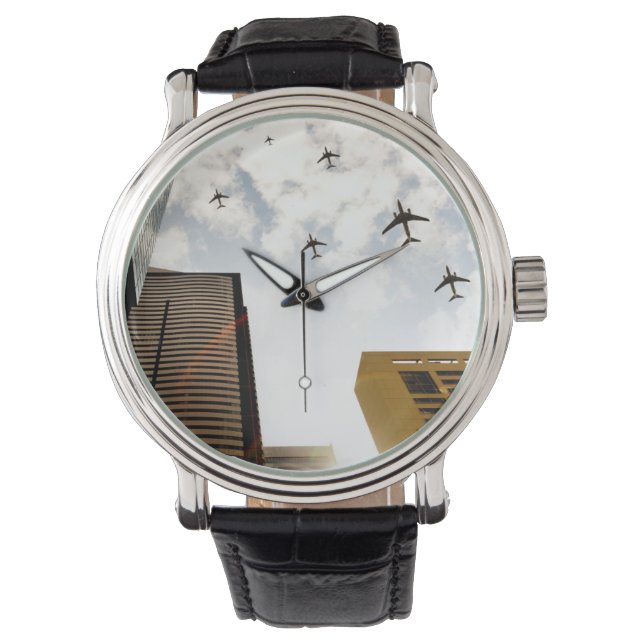 Aeroplanes flying over buildings watch (Front)