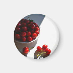 Aesthetic still life with ripe cherries on a white magnet
