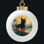 Affenpinscher Beach Surfing Painting Ceramic Ball Christmas Ornament<br><div class="desc">Immerse yourself in the playful world of canine adventure with this captivating painting. A spirited dog takes to the waves, skilfully riding the surf on a sun-kissed beach. The vibrant artwork beautifully captures the essence of beachside excitement as the dog fearlessly rides the waves, embodying the spirit of fun and...</div>