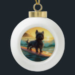 Affenpinscher Beach Surfing Painting Ceramic Ball Christmas Ornament<br><div class="desc">Immerse yourself in the playful world of canine adventure with this captivating painting. A spirited dog takes to the waves, skilfully riding the surf on a sun-kissed beach. The vibrant artwork beautifully captures the essence of beachside excitement as the dog fearlessly rides the waves, embodying the spirit of fun and...</div>