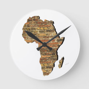 Africa and ancient brick wall round clock