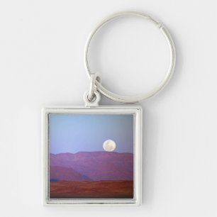 Africa, Namibia, Sossusvlei. A full moon rests Key Ring