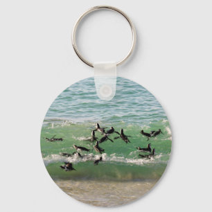 African penguins swimming at beach key ring