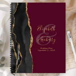 Agate Geode Script Black Gold Burgundy Wedding Planner<br><div class="desc">This elegant modern wedding planner features a black watercolor design trimmed with faux gold glitter. Easily customise the gold coloured text on a burgundy background, with the names of the bride and groom in handwriting calligraphy over a large ampersand. Add the title and wedding date below in italics. The back...</div>