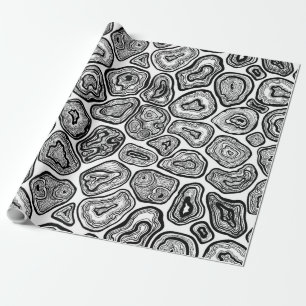 Agate slices in black and white wrapping paper