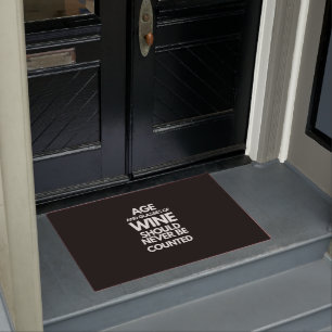 Age and Glasses of Wine Should Never Be Counted Doormat