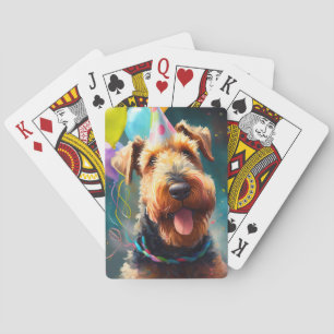 Airedale dog with birthday hat and balloons  playing cards