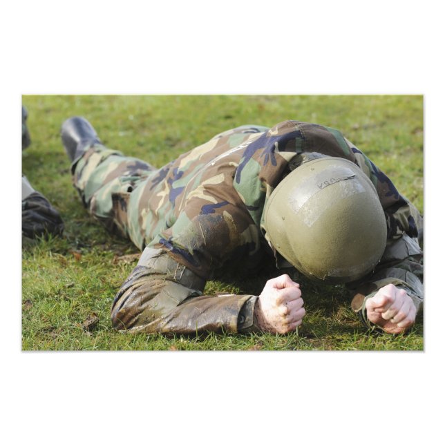 Airman crawls through a wet field photo print (Front)