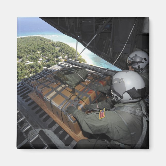 Airmen push out a pallet of donated goods 2 magnet (Front)