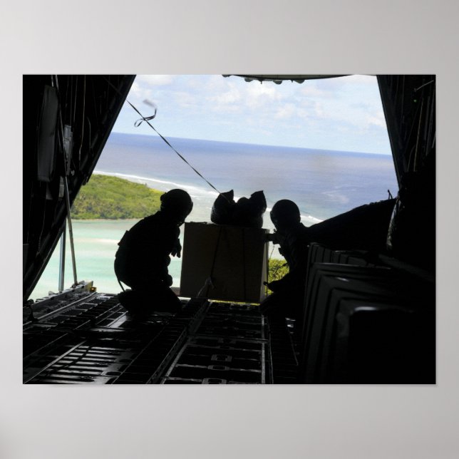 Airmen push out a pallet of donated goods 2 poster (Front)