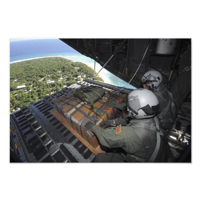 Airmen push out a pallet of donated goods photo print (Front)