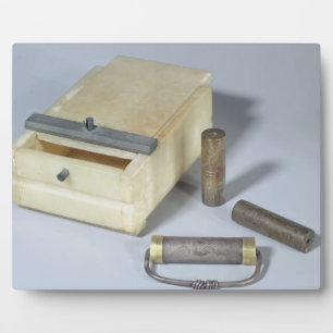 Alabaster box and bronze and silver seal cylinders plaque