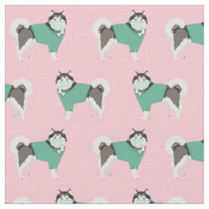 alaskan malamute in scrubs in pink fabric