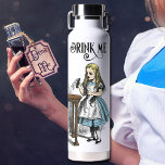 Alice in Wonderland Drink Me Colour Illustration Water Bottle<br><div class="desc">Fun Alice in Wonderland "Drink Me" Water Bottle. The vintage line art drawing of Alice holding the tagged "drink me" bottle is a copy of the illustration by John Tenniel from the first edition of Lewis Carroll's book published in 1865. Both sides of the bottle are printed This Thor copper...</div>