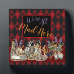 Alice in Wonderland Mad Cheshire Cat Plaque<br><div class="desc">This colourful new design is based on Alice in Wonderland classic drawings,  from the 1800s,  showing the mad tea party with Alice,  the Mad Hatter,  the Cheshire Cat,  and the White Rabbit as well as a variety of characters. From Alice in Wonderland by Lewis Carroll.</div>