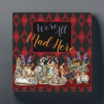 Alice in Wonderland Mad Cheshire Cat Plaque<br><div class="desc">This colourful new design is based on Alice in Wonderland classic drawings,  from the 1800s,  showing the mad tea party with Alice,  the Mad Hatter,  the Cheshire Cat,  and the White Rabbit as well as a variety of characters. From Alice in Wonderland by Lewis Carroll.</div>