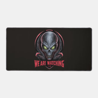 Alien with Glowing Green Eyes We are Watching Desk Mat