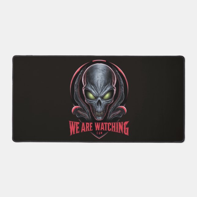 Alien with Glowing Green Eyes We are Watching Desk Mat (Front)