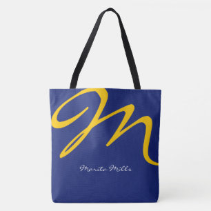 all-over-print blue tote bag with yellow initial