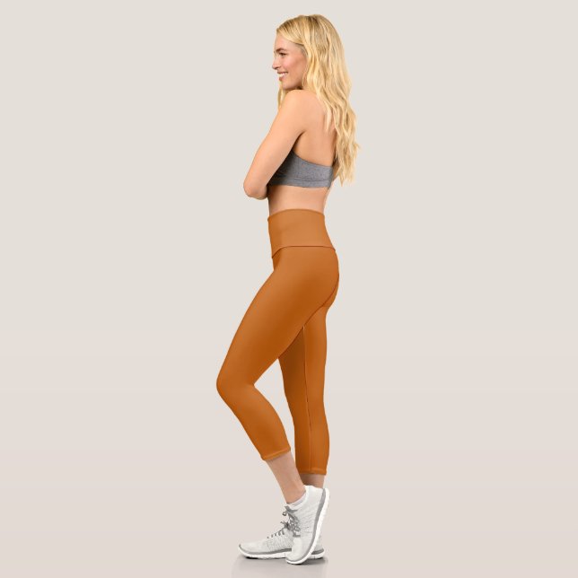 Alloy orange (solid colour) capri leggings (Left)