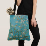 Almond Blossom, Oil Painting, Vincent Van Gogh Tote Bag<br><div class="desc">Vincent Van Gogh,  February 1890
oil on canvas
post-impressionist oil painting depicting a flowering blooming almond tree with white flowers and green-blue branches against a muted teal background

sophisticated elegant fancy chic quirky boho stately eclectic bohemian maximalist fine modern classic art decor</div>