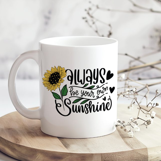 Always Be Your Own Sunshine Sunflower Mug ("Always Be Your Own Sunshine" Sunflower Quote Coffee Mug on a boho kitchen table with tiny flowers)
