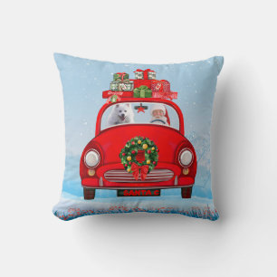American Eskimo Dog In Car With Santa Claus Cushion