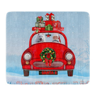 American Eskimo Dog In Car With Santa Claus Cutting Board