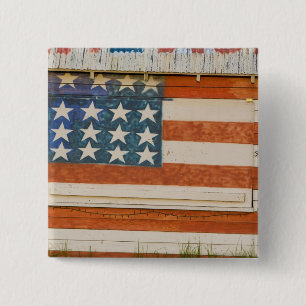 American flag painted onto fireworks stand near 15 cm square badge