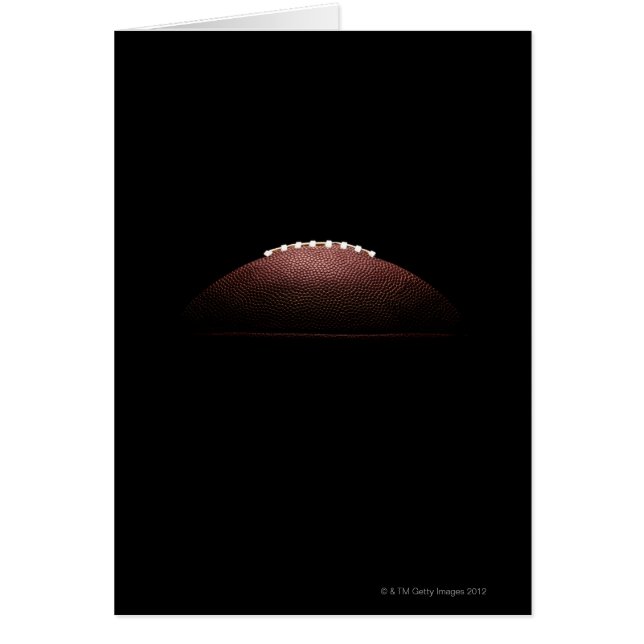 American football ball on black background (Front)