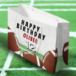 American Football Balls Kids Happy Birthday Large Gift Bag<br><div class="desc">American Football Balls Kids Happy Birthday Large Gift Bag. Football themed birthday gift bag with child`s name,  age and football balls. Add your name and age. Great for kids who love football and sports.</div>