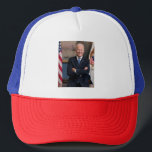 American President Joe Biden as Senator Trucker Hat<br><div class="desc">The photograph captures a moment in time before president elect Joe Biden appointed office of Vice President of the United States. Sunlight streams through a window, casting a warm glow on the figure of an Biden standing confidently in the center of the frame. His arms are crossed, a gesture that...</div>