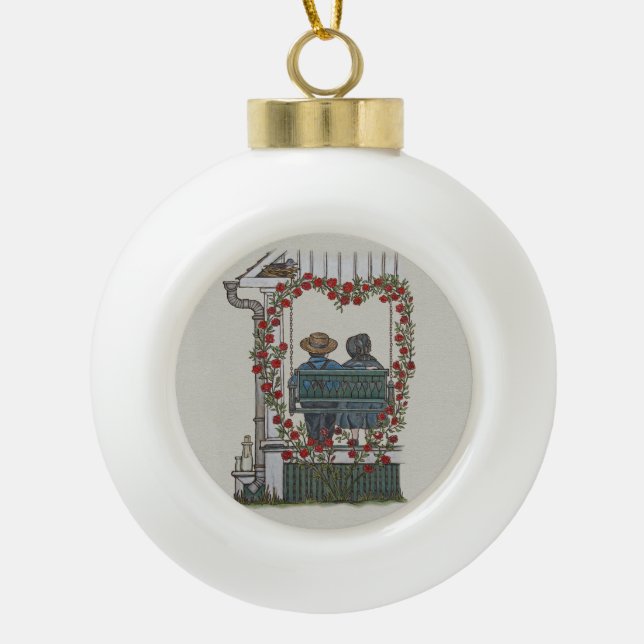 Amish Couple On Porch Swing Ceramic Ball Christmas Ornament (Front)