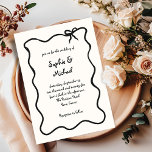 Amour | Illustrated French Bow Wedding Invitation<br><div class="desc">This chic and elegant wedding invitation features a hand drawn,  wavy illustrated frame with a bow,  and stylish handwritten script for a Parisian or French style wedding invitation. This classic colour option is ivory and black.</div>