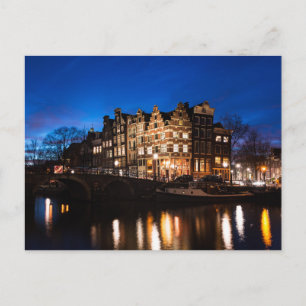Amsterdam canal houses at night postcard