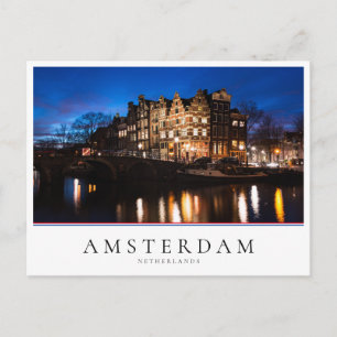 Amsterdam canal houses at night postcard