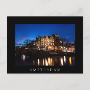 Amsterdam canal houses at night postcard