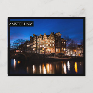 Amsterdam canal houses at night postcard