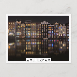 Amsterdam houses with colorful lights in the night postcard