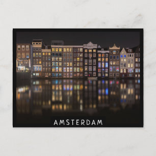 Amsterdam houses with colorful lights in the night postcard