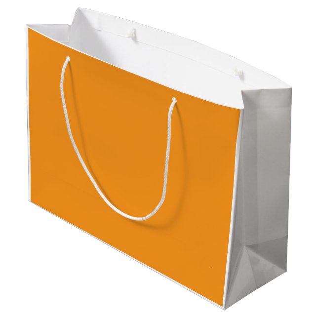 An abstract blend of vibrant orange, red, and yell large gift bag (Back Angled)