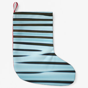 An abstract wave ripple background made from water small christmas stocking