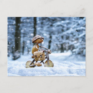 An acorn elf is biking to work in winter postcard